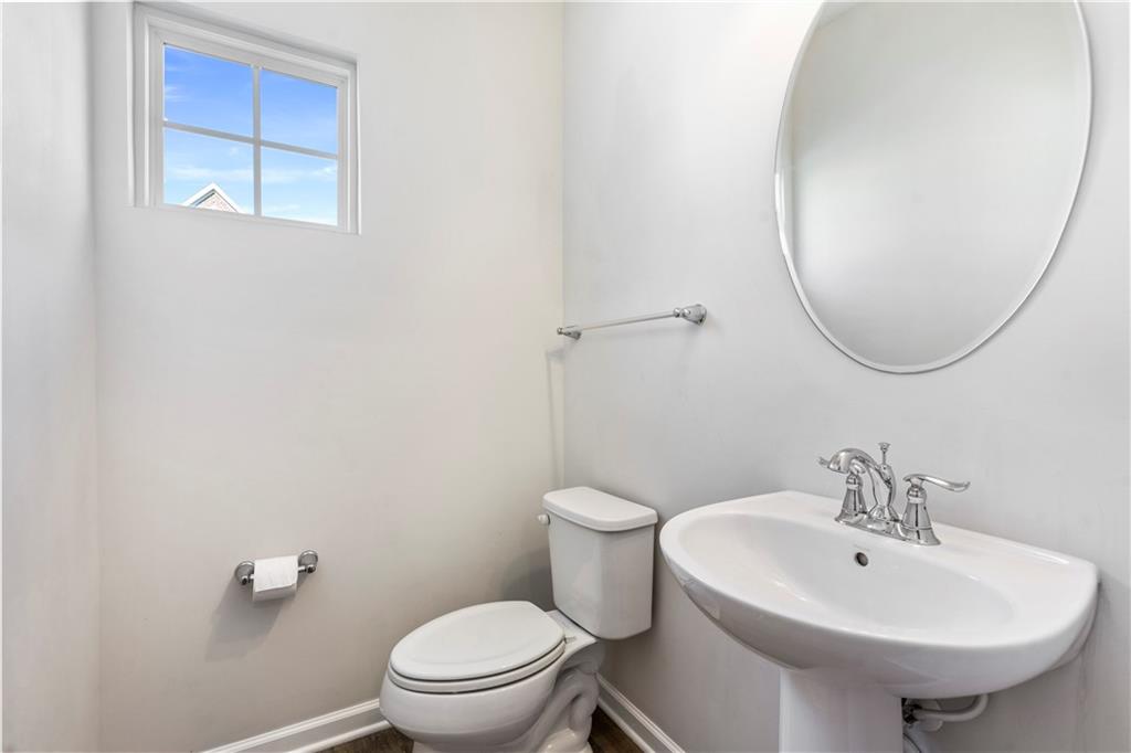 104 Pointe View Drive Mars, PA 16046 - Photo 24 of 25 a bathroom with a sink a toilet and a mirror