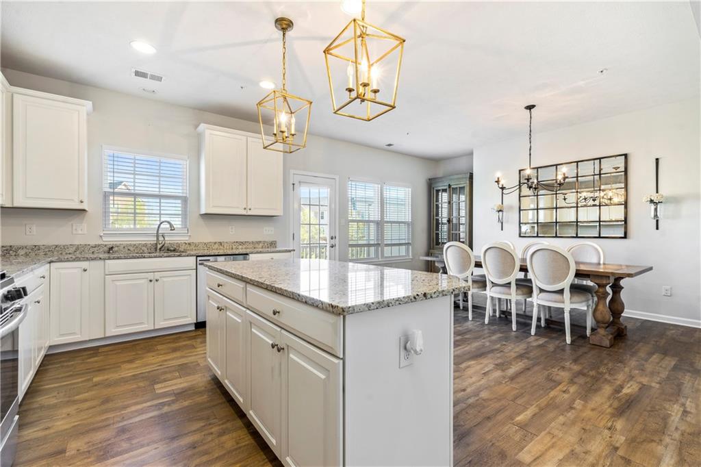 104 Pointe View Drive Mars, PA 16046 - Photo 7 of 25 a open kitchen with granite countertop cabinets a dining table and chairs