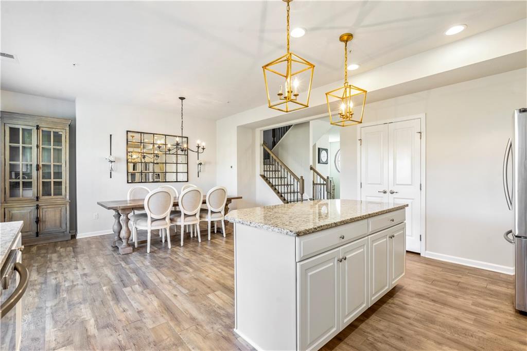 104 Pointe View Drive Mars, PA 16046 - Photo 9 of 25 a view of a dining room and livingroom with furniture wooden floor a chandelier