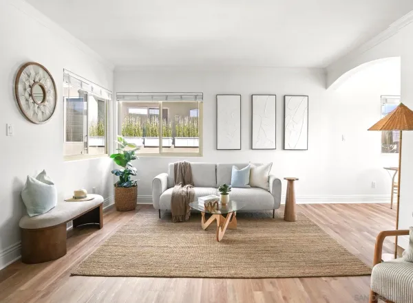 a living room with furniture and a large window
