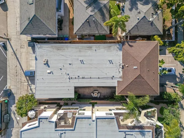 an aerial view of a house with a garden and plants