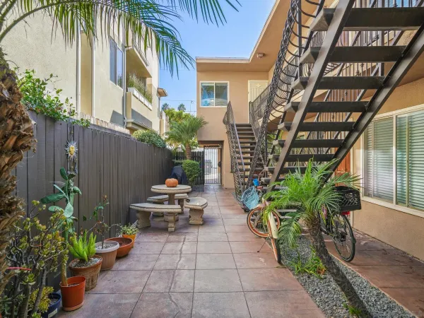 a view of a chair and table in the patio