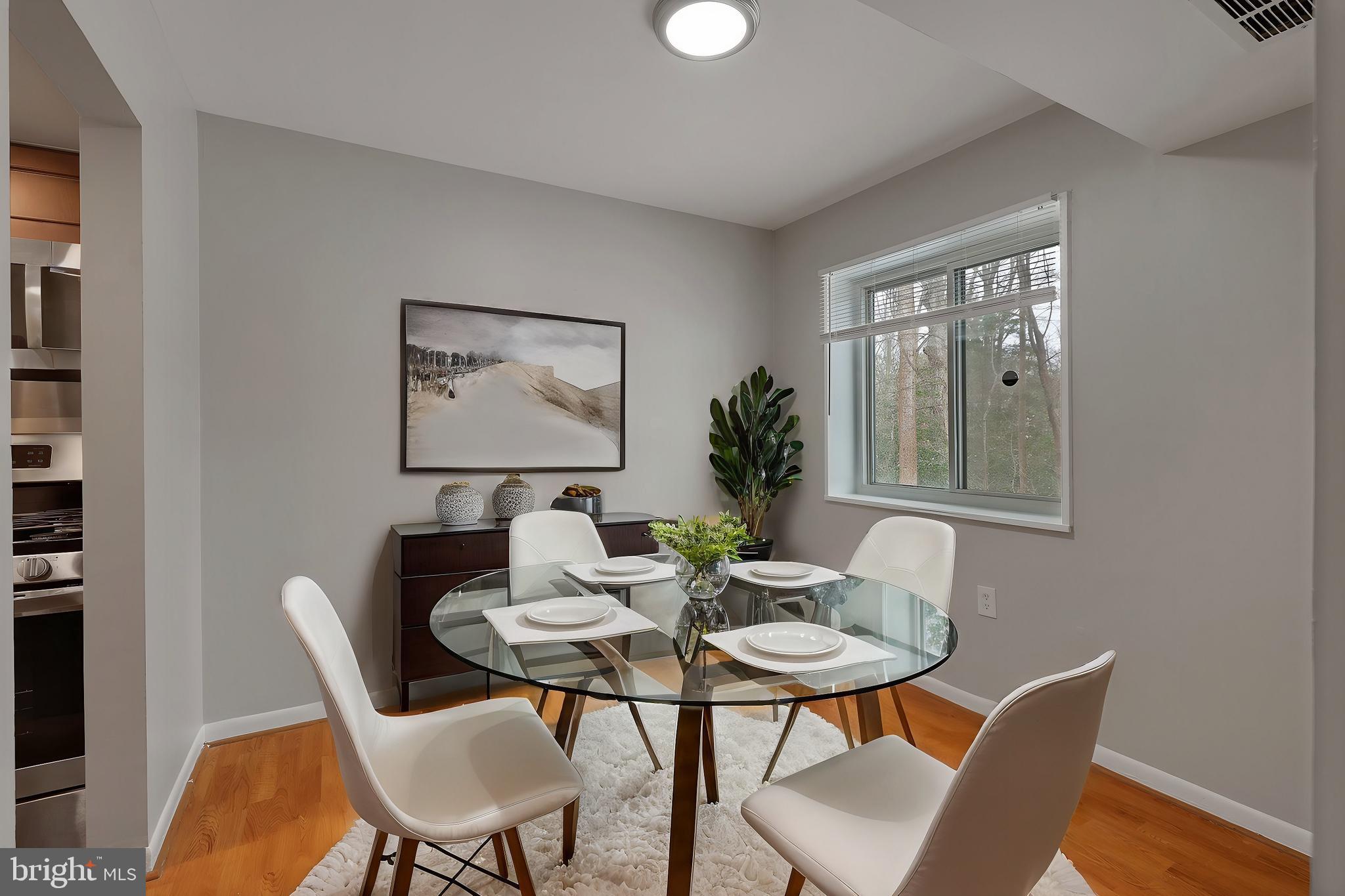 1554 Northgate Square, Unit 2A Reston, VA 20190 - Photo 5 of 11 a dining room with furniture and window