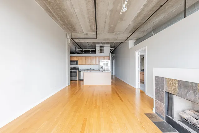 a view of kitchen with cabinets and wooden floor