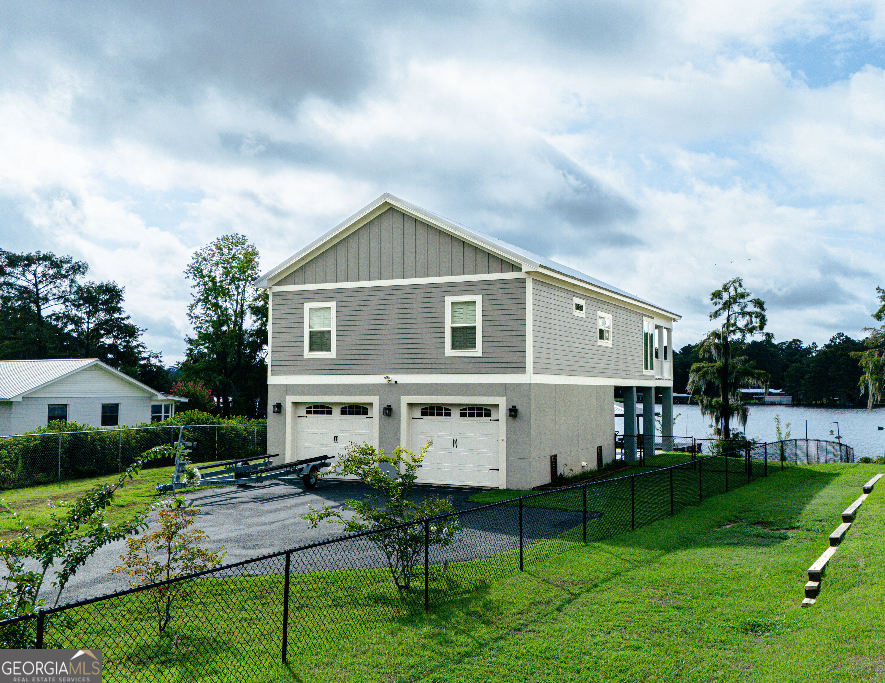 a front view of house with a garden