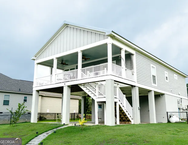 a front view of a house with a yard and porch