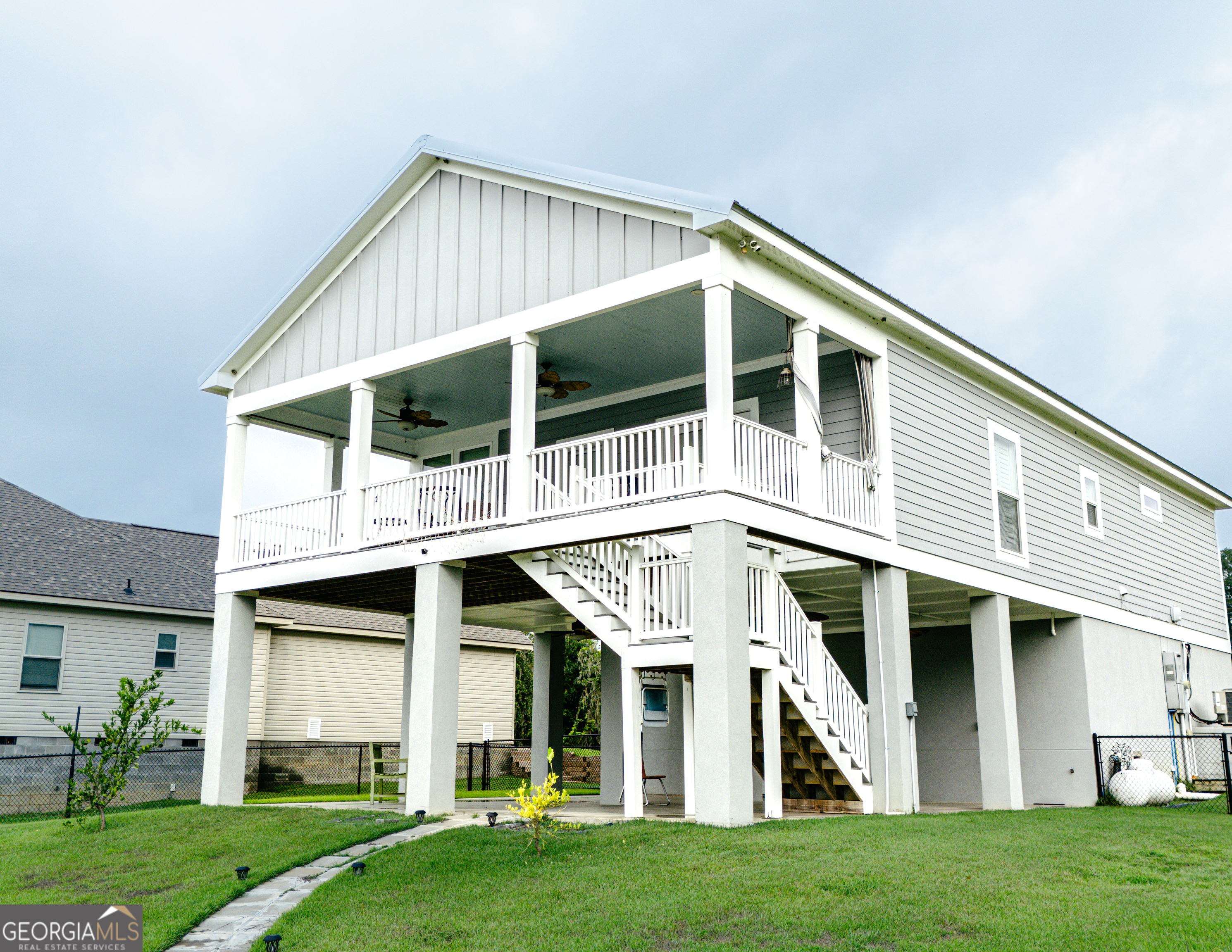 475 Cedar Creek Road North Cordele, GA 31015 - Photo 12 of 50 a front view of a house with a yard and porch