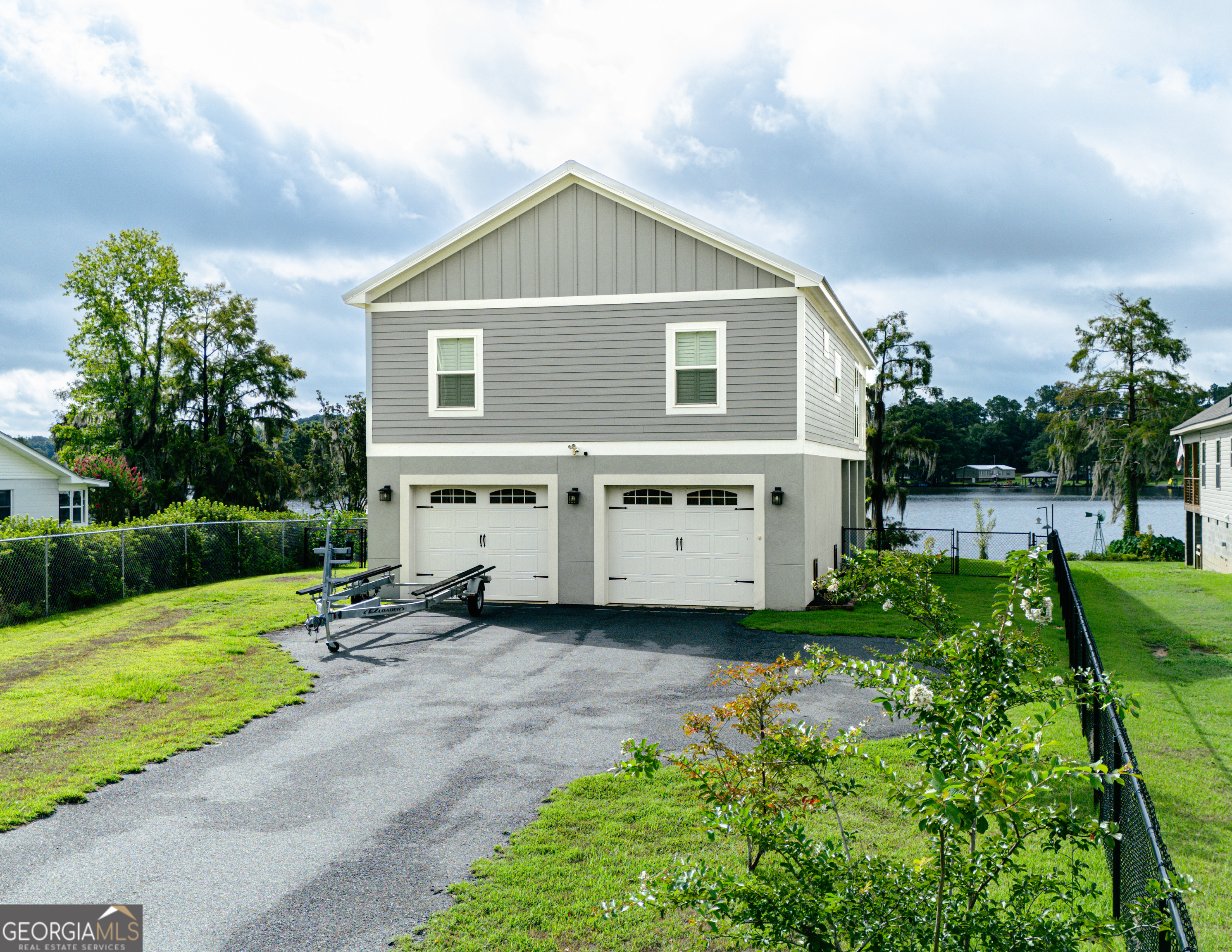 475 Cedar Creek Road North Cordele, GA 31015 - Photo 17 of 50 a view of a house with yard and a garden