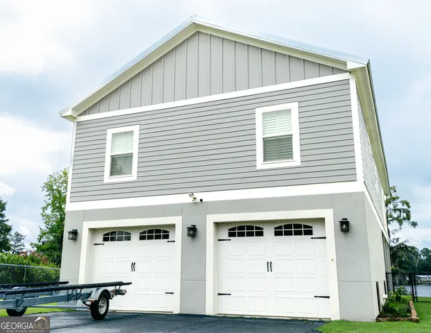 a front view of a building with parking