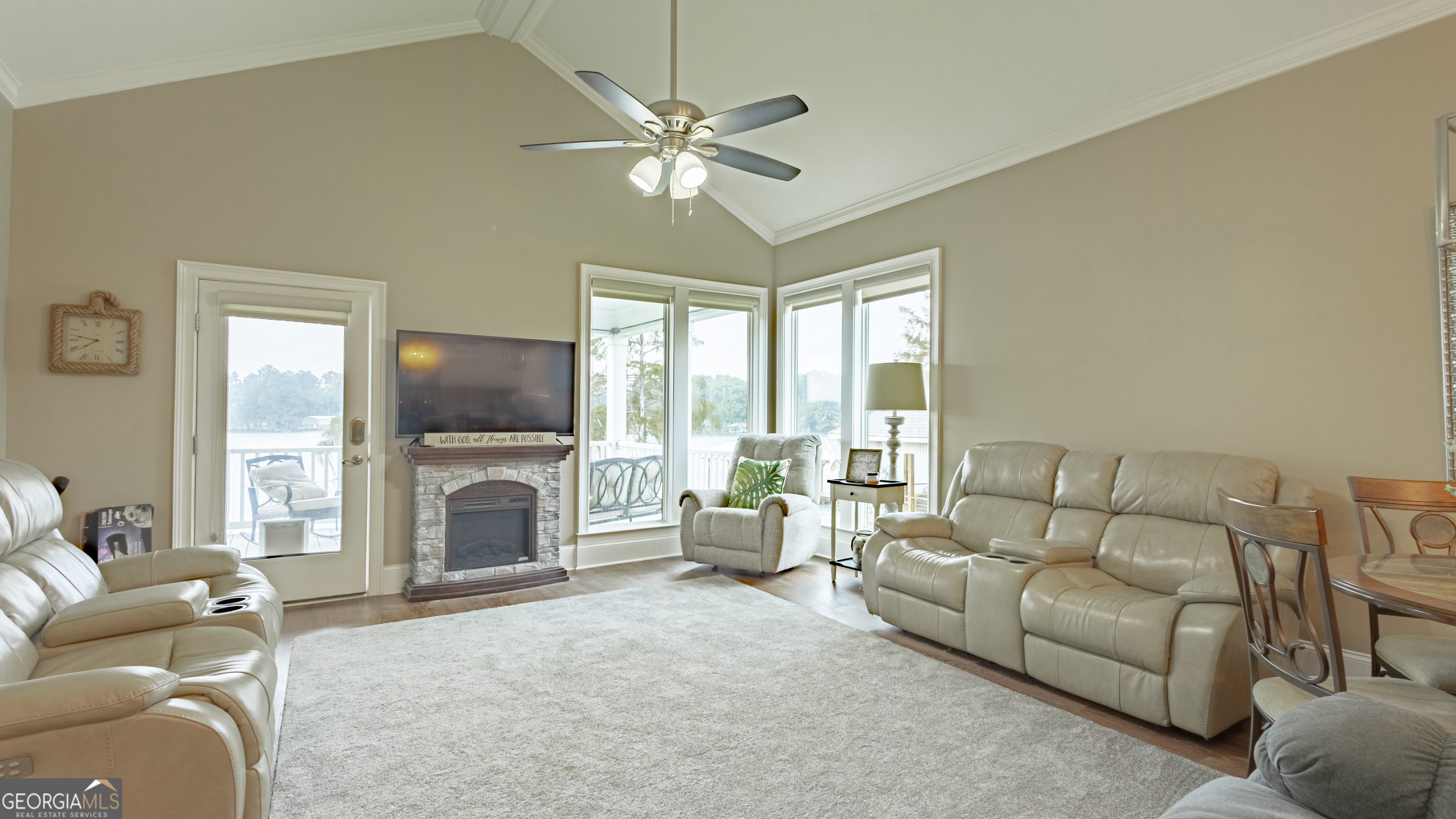 475 Cedar Creek Road North Cordele, GA 31015 - Photo 29 of 50 a living room with furniture a flat screen tv and a large window with the view