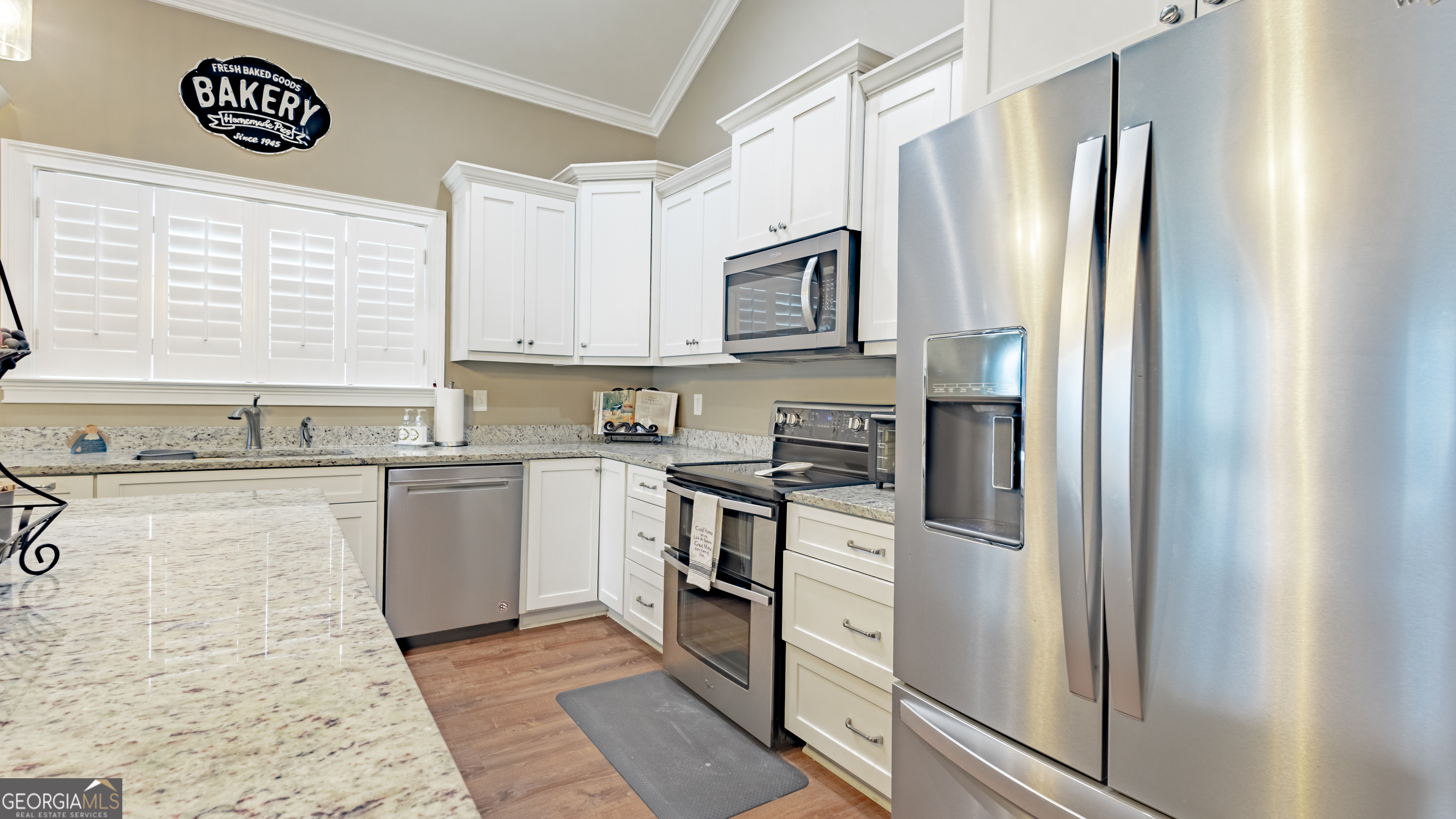 475 Cedar Creek Road North Cordele, GA 31015 - Photo 30 of 50 a kitchen with stainless steel appliances granite countertop a refrigerator and a stove top oven