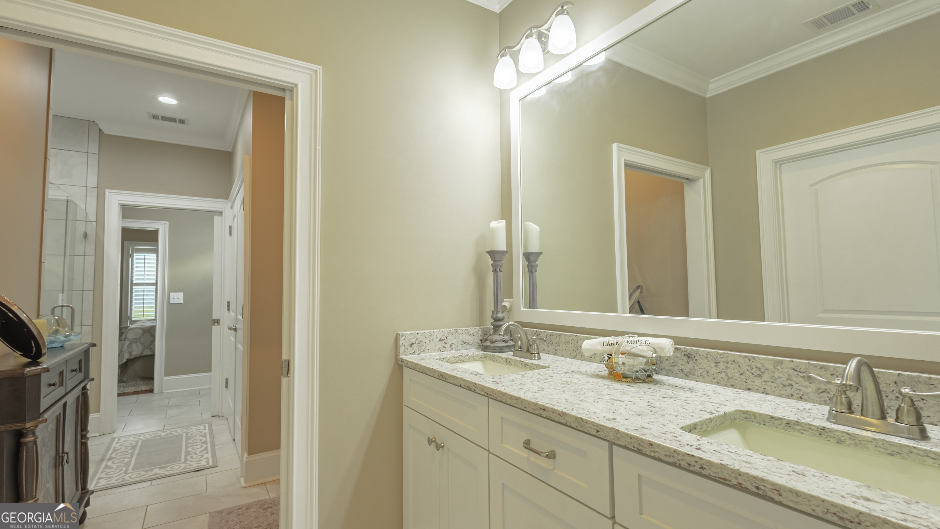 475 Cedar Creek Road North Cordele, GA 31015 - Photo 36 of 50 a bathroom with double sink and a mirror