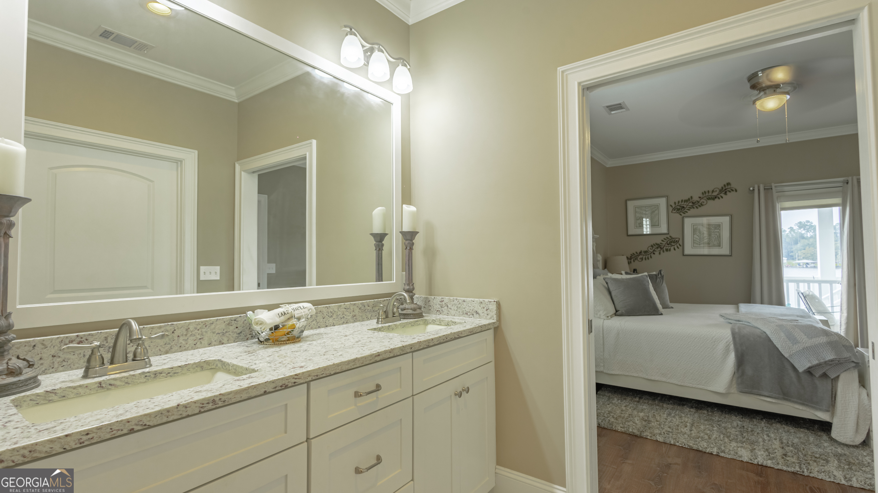 475 Cedar Creek Road North Cordele, GA 31015 - Photo 37 of 50 a en suite bathroom with double sink and a mirror