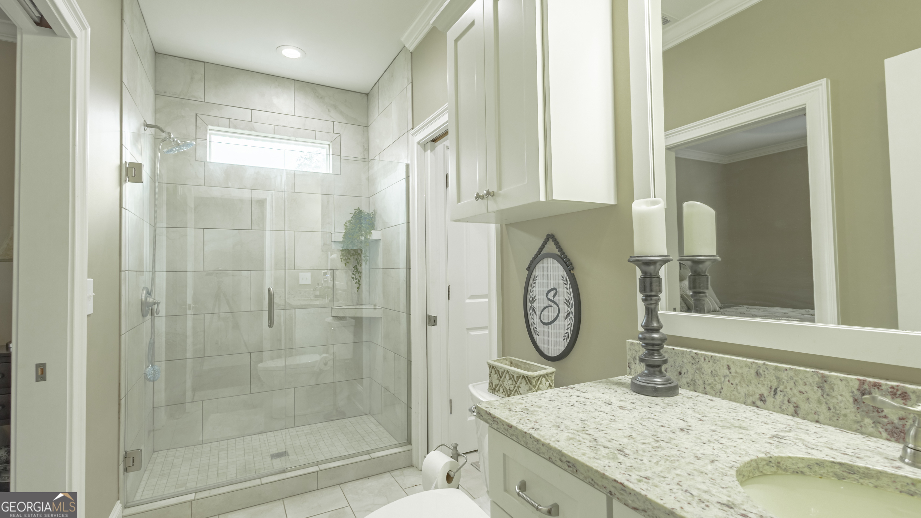 475 Cedar Creek Road North Cordele, GA 31015 - Photo 40 of 50 a bathroom with a granite countertop sink a toilet and a shower