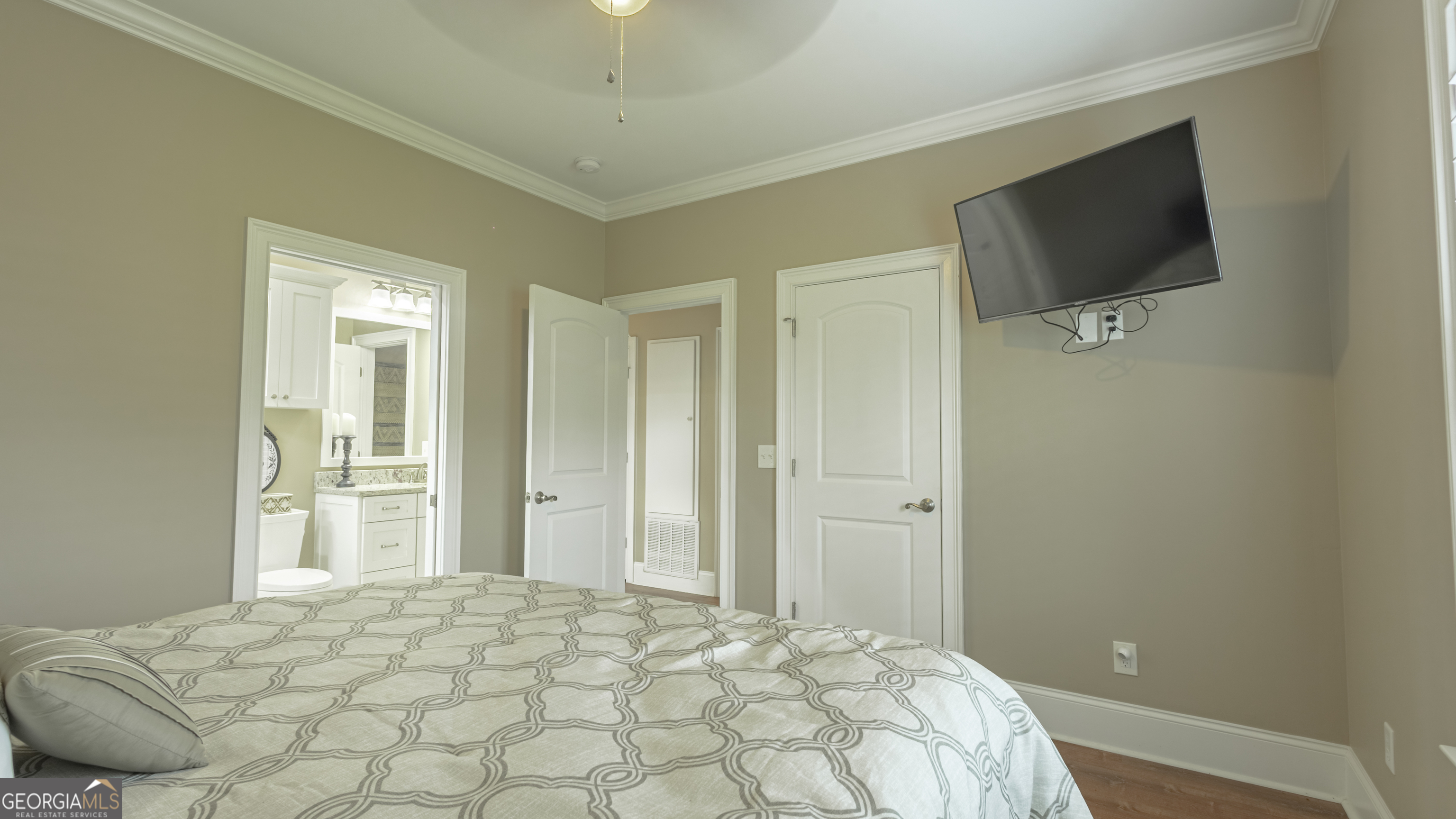 475 Cedar Creek Road North Cordele, GA 31015 - Photo 42 of 50 a bedroom with a bed and a flat screen tv