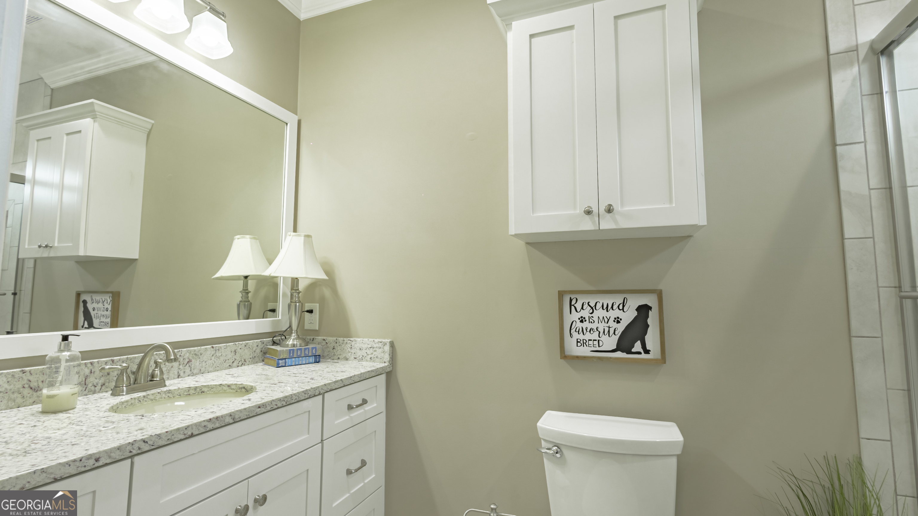 475 Cedar Creek Road North Cordele, GA 31015 - Photo 44 of 50 a bathroom with a granite countertop sink a toilet and a mirror