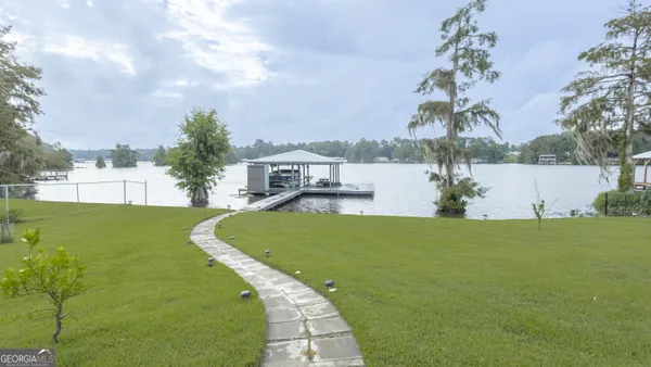 a view of a lake with a big yard