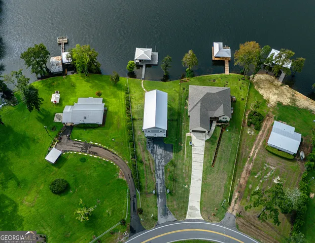 an aerial view of a house having yard