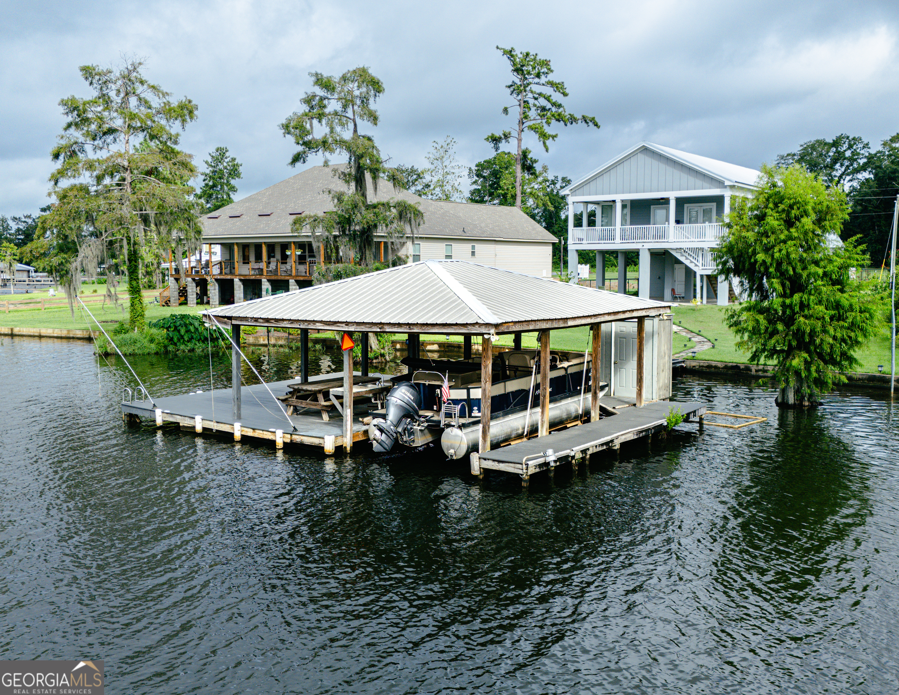 475 Cedar Creek Road North Cordele, GA 31015 - Photo 10 of 50 a view of a house with pool and chairs