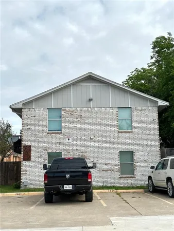 a car parked in front of a house