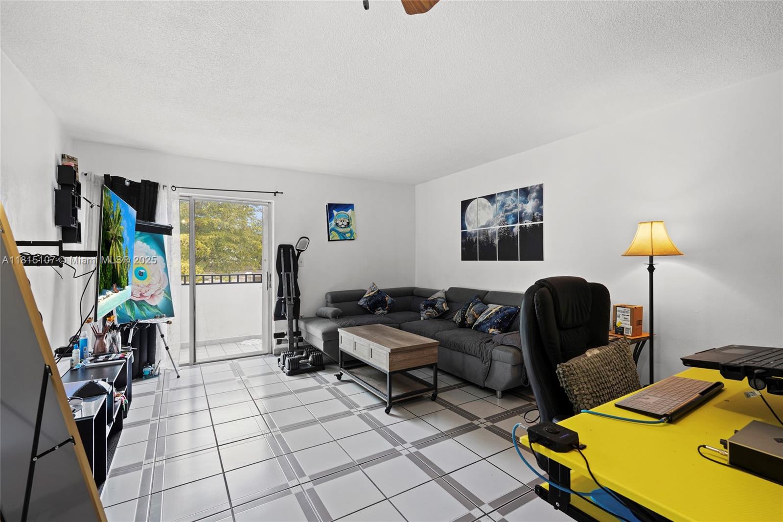 2498 Southwest 17th Avenue, Unit 4311 Miami, FL 33133 - Photo 1 of 19 a living room with furniture and a window