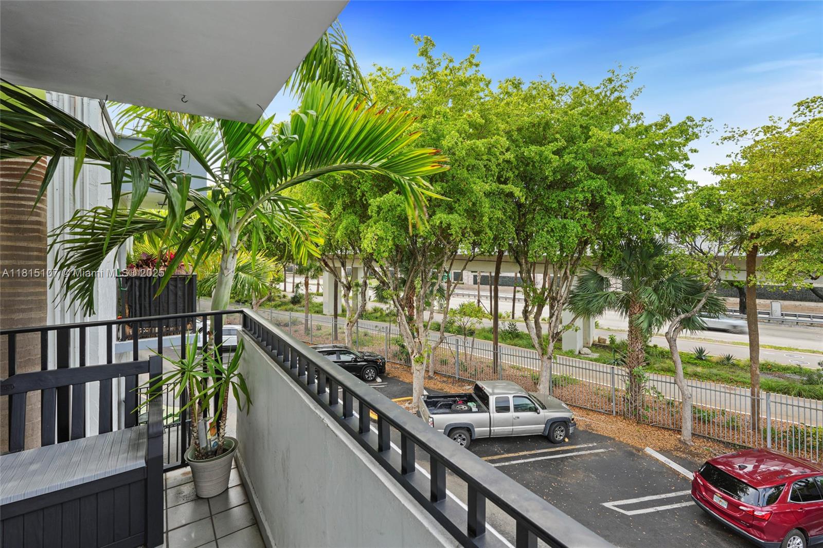 2498 Southwest 17th Avenue, Unit 4311 Miami, FL 33133 - Photo 16 of 19 a view of a balcony with lake view and a potted plant