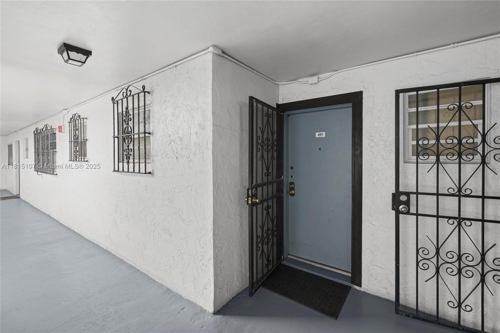 2498 Southwest 17th Avenue, Unit 4311 Miami, FL 33133 - Photo 19 of 19 a view of a hallway with entryway door