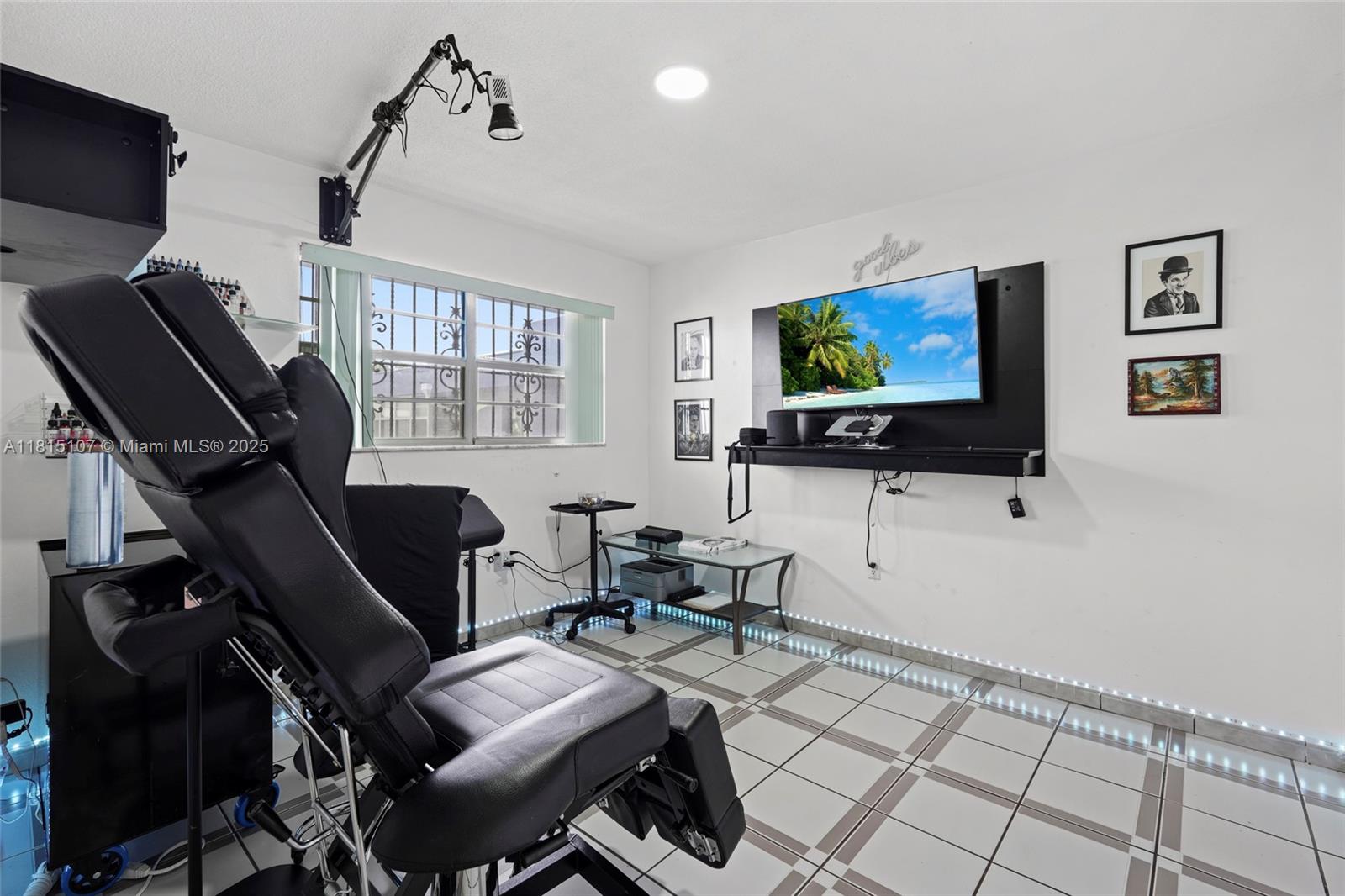 2498 Southwest 17th Avenue, Unit 4311 Miami, FL 33133 - Photo 4 of 19 a living room with furniture and a flat screen tv