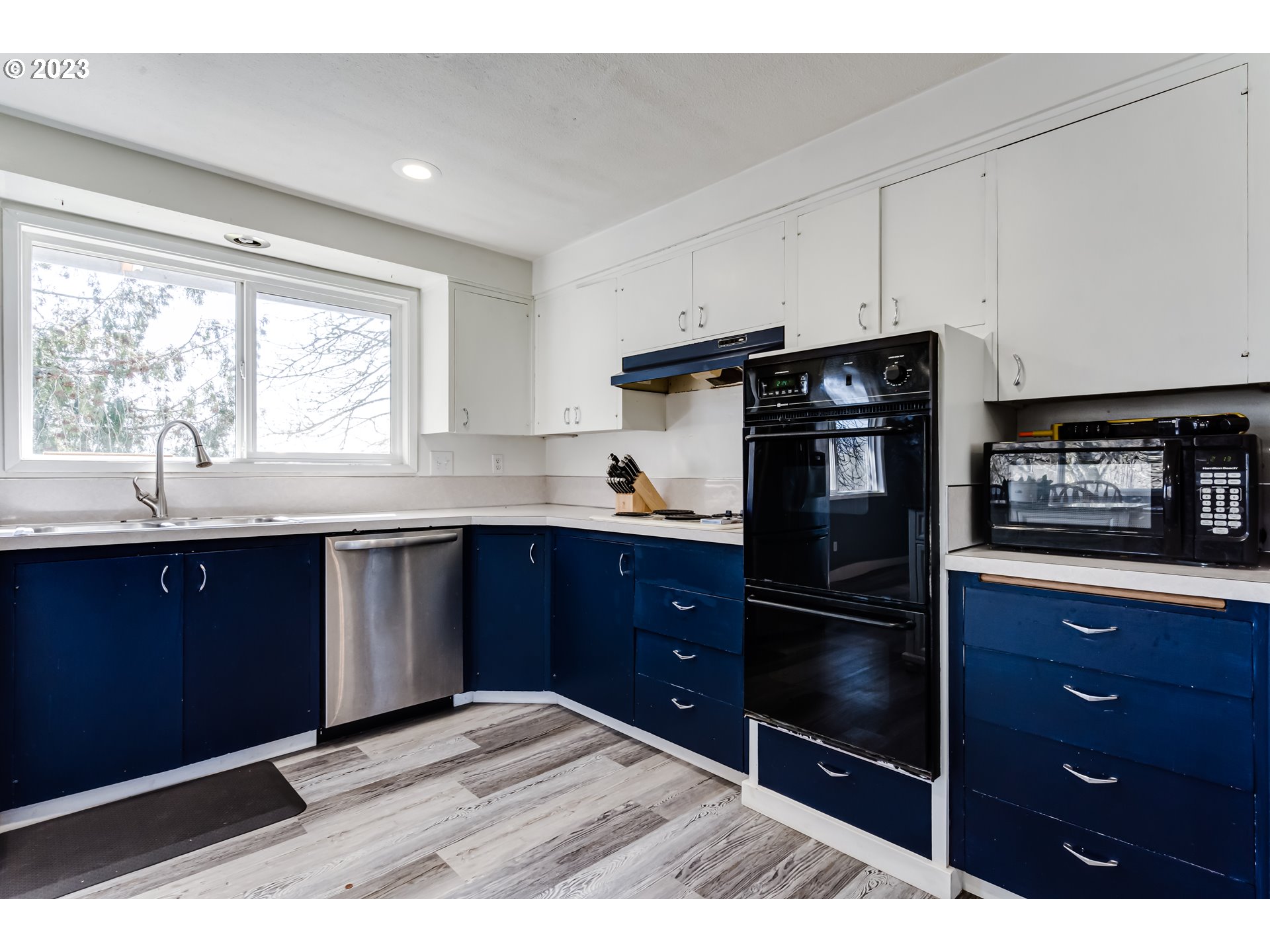 1109 Linda Lane Springfield, OR 97478 - Photo 11 of 30 a kitchen with granite countertop wooden cabinets and stainless steel appliances