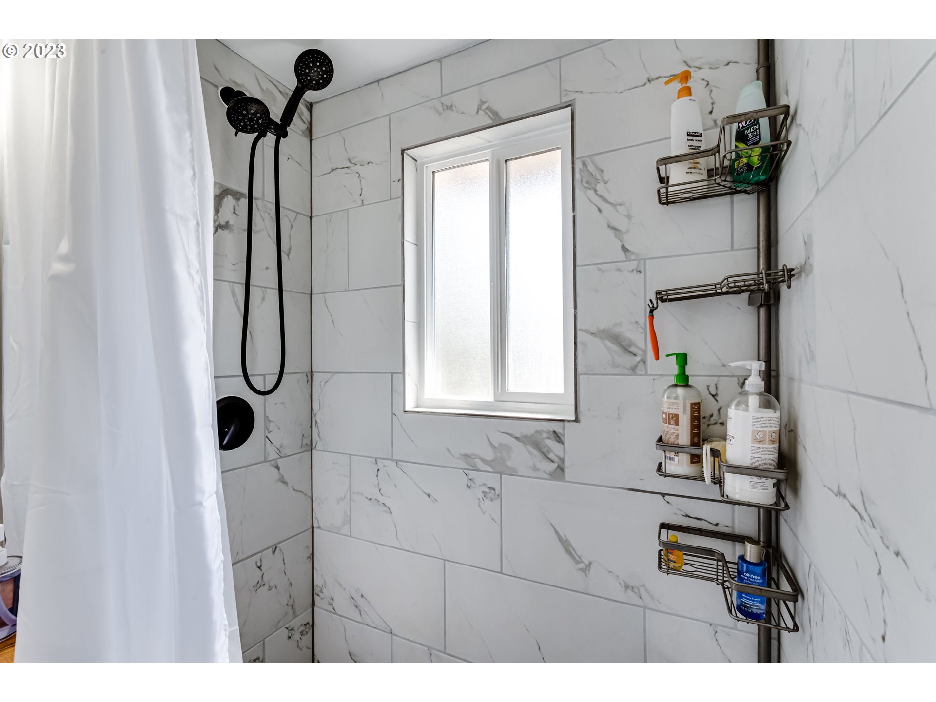 1109 Linda Lane Springfield, OR 97478 - Photo 21 of 30 a bathroom with a sink and mirror with bathtub