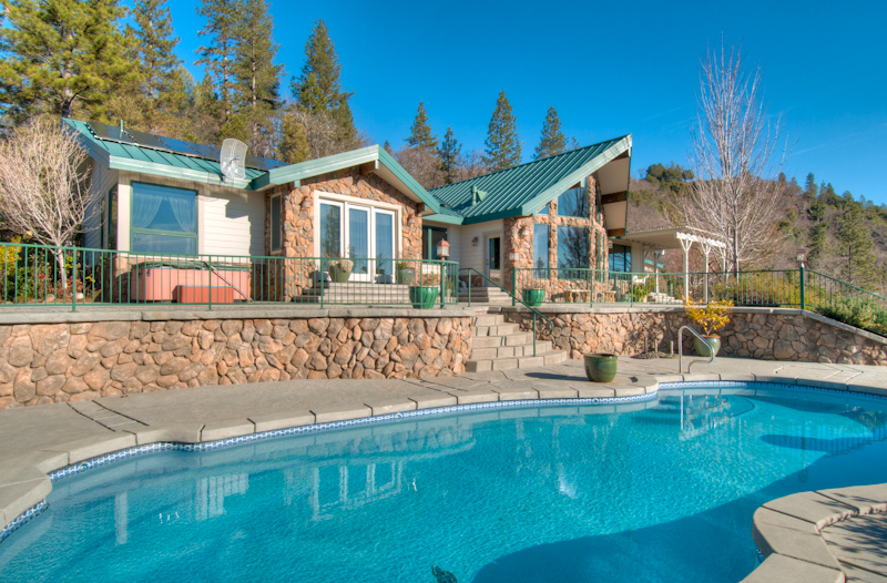 19200 Mountain Maple Road Lakehead, CA 96051 - Photo 4 of 36 a view of a house with pool and chairs