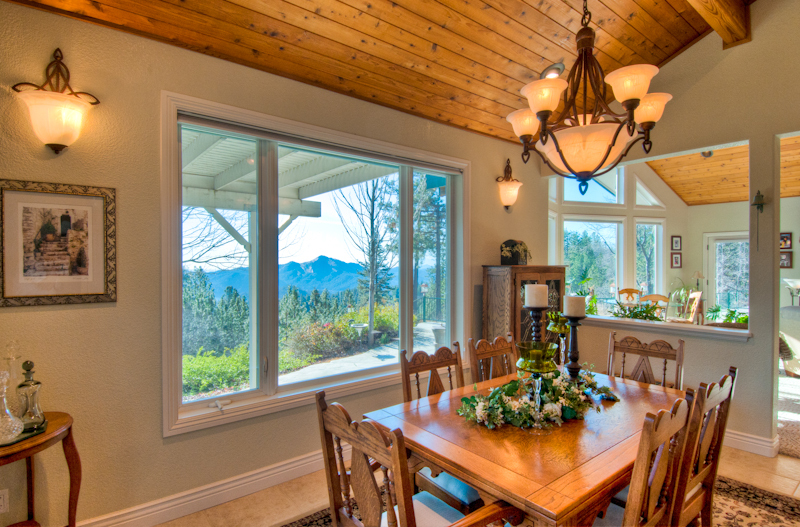 19200 Mountain Maple Road Lakehead, CA 96051 - Photo 10 of 36 a view of a dining room with furniture large windows and wooden floor