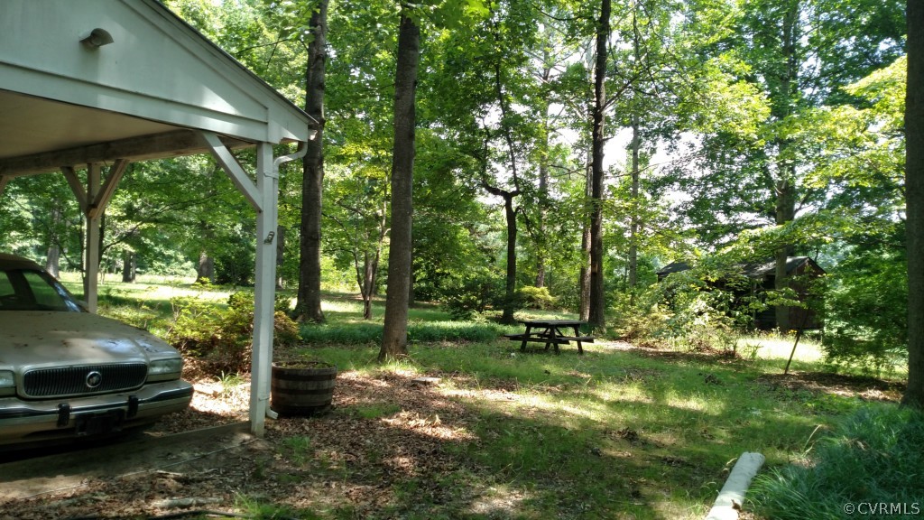 16397 Old Ridge Road Montpelier, VA 23192 - Photo 8 of 10 a view of a wooden house with a yard