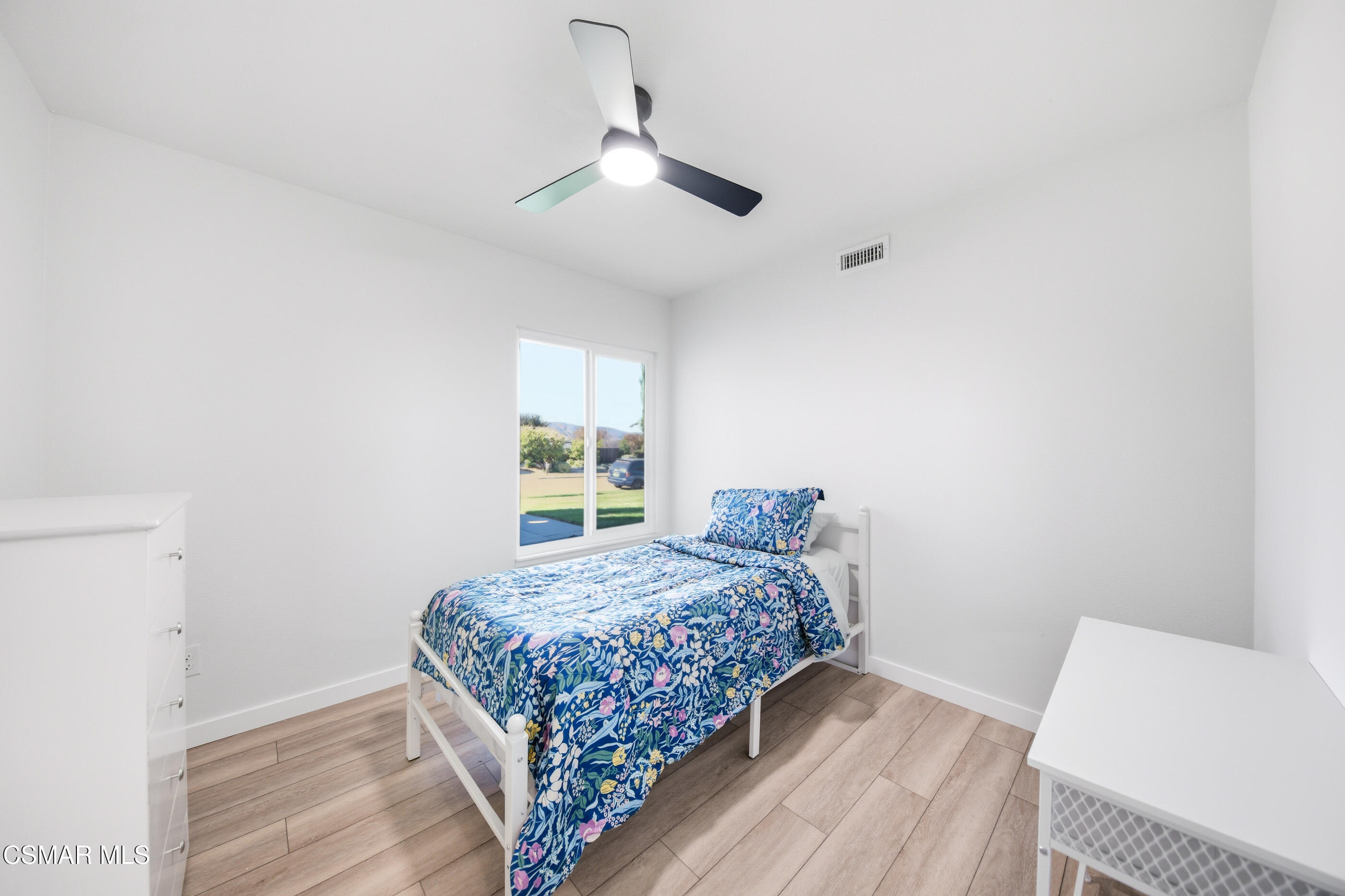 6417 Keystone Street Simi Valley, CA 93063 - Photo 23 of 31 a bedroom with a bed and window