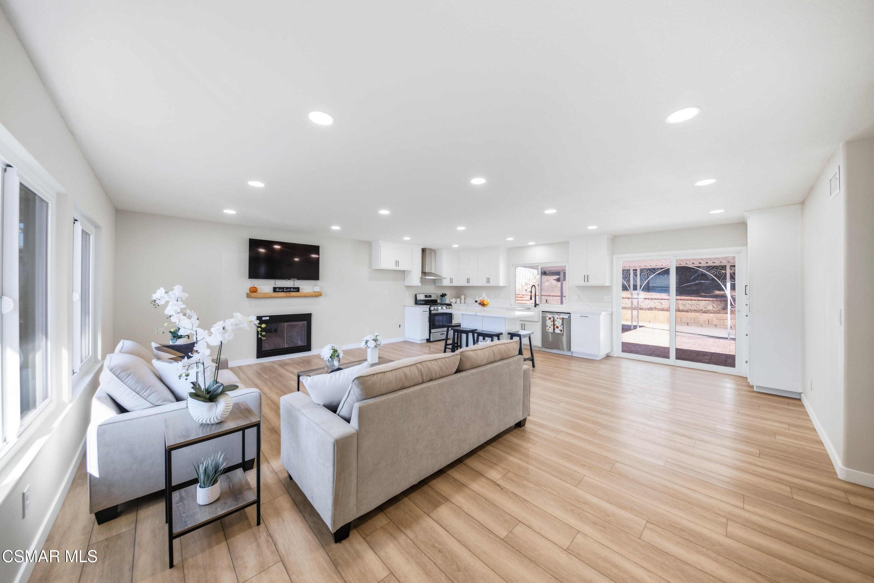 6417 Keystone Street Simi Valley, CA 93063 - Photo 4 of 31 a living room with furniture and a view of kitchen
