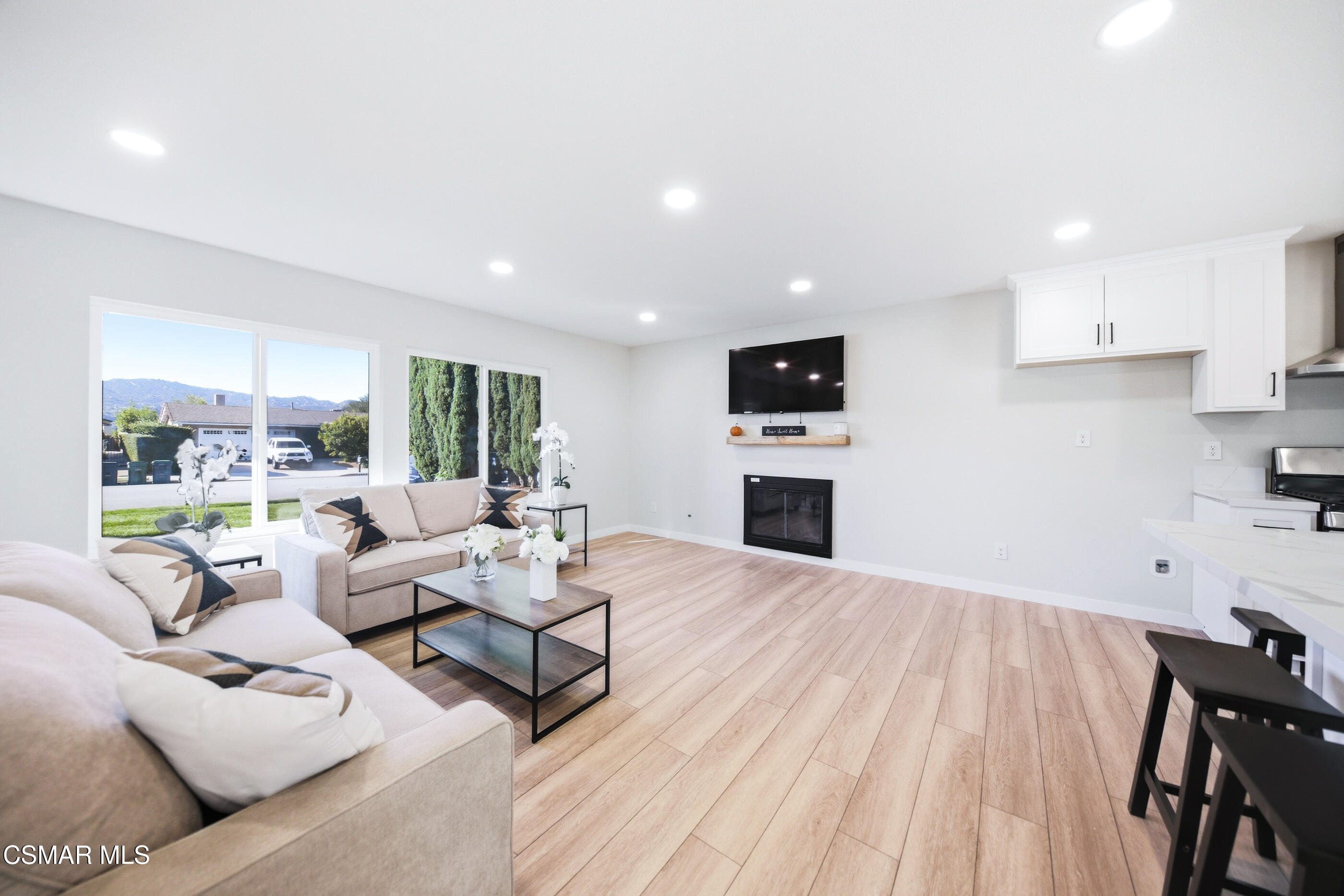 6417 Keystone Street Simi Valley, CA 93063 - Photo 5 of 31 a living room with fireplace furniture and a wooden floor