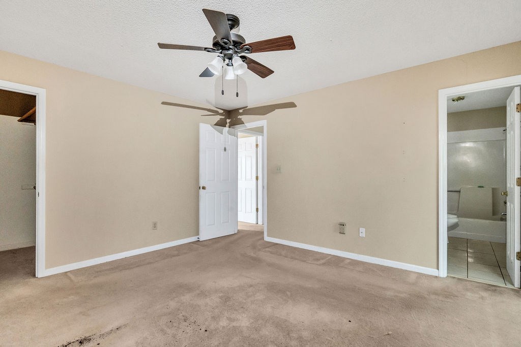 5800 Yellow Creek Road Murrayville, GA 30564 - Photo 14 of 29 an empty room and a chandelier fan