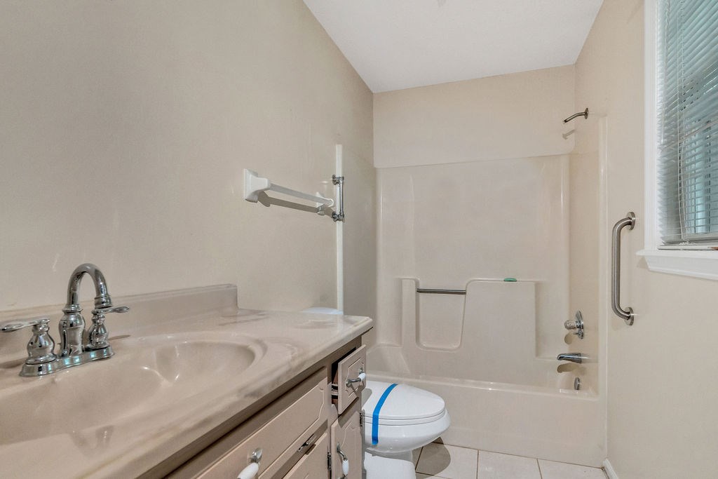 5800 Yellow Creek Road Murrayville, GA 30564 - Photo 18 of 29 a bathroom with a granite countertop sink toilet and shower