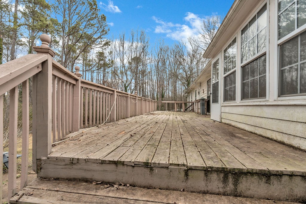 5800 Yellow Creek Road Murrayville, GA 30564 - Photo 21 of 29 a view of a backyard with wooden fence