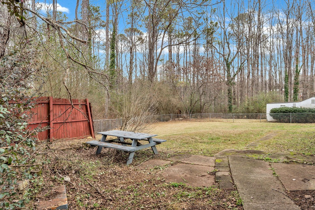 5800 Yellow Creek Road Murrayville, GA 30564 - Photo 28 of 29 a backyard of a house with table and chairs