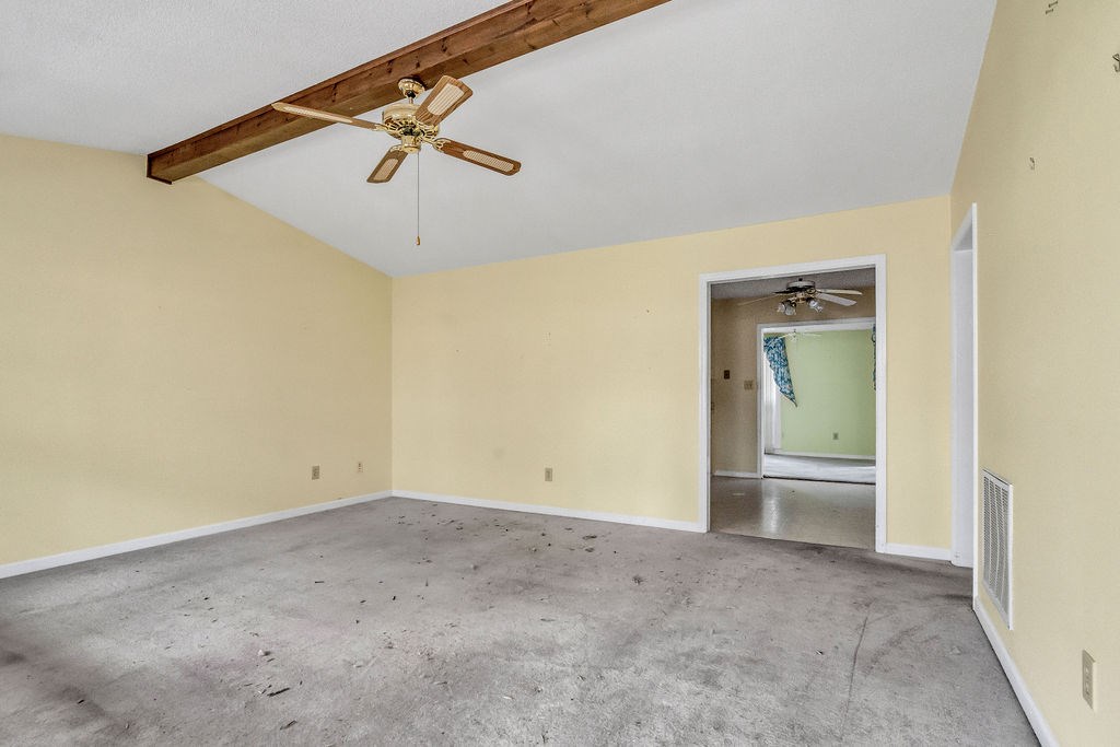 5800 Yellow Creek Road Murrayville, GA 30564 - Photo 3 of 29 an empty room with a ceiling fan and carpet