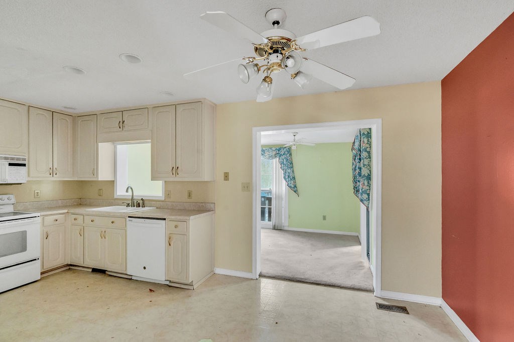 5800 Yellow Creek Road Murrayville, GA 30564 - Photo 5 of 29 a view of a kitchen with a sink cabinets and a window