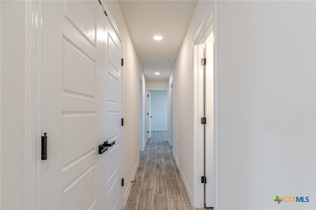 403 North Bauer Street Seguin, TX 78155 - Photo 17 of 27 a view of a hallway with wooden floor
