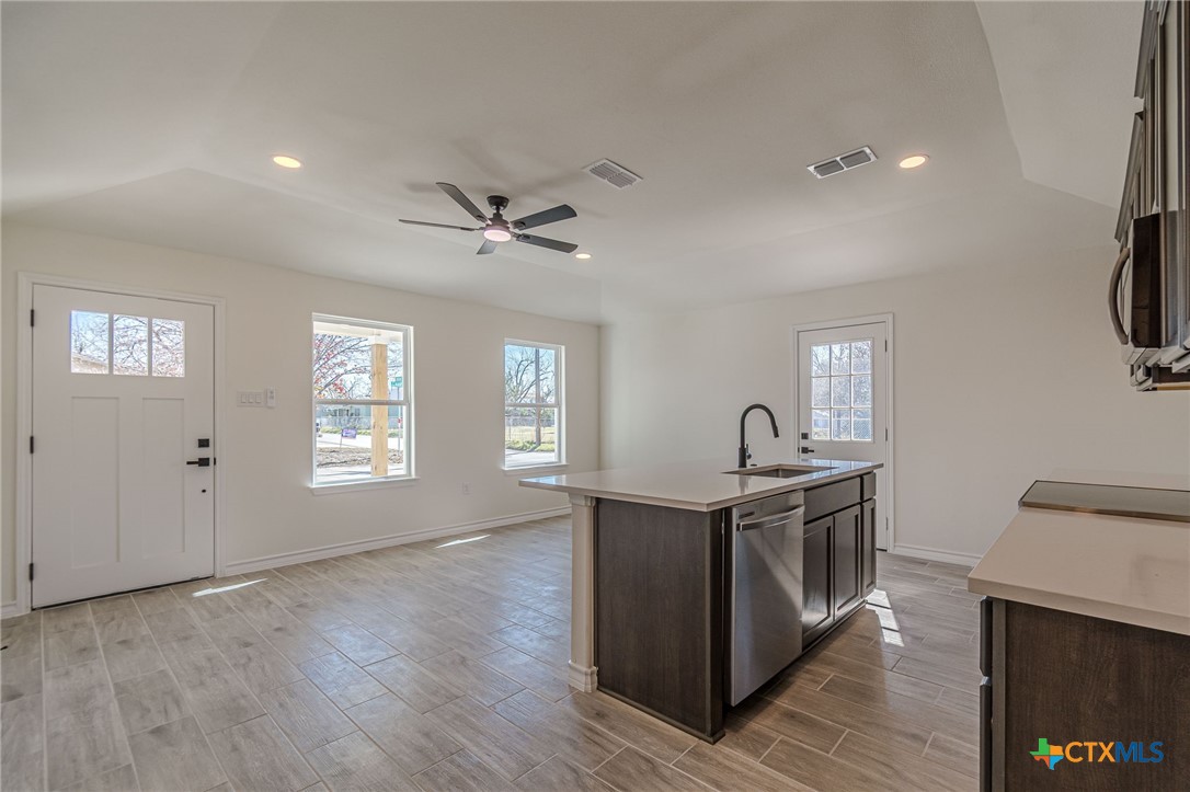403 North Bauer Street Seguin, TX 78155 - Photo 18 of 27 a view of a kitchen counter space a sink and appliances