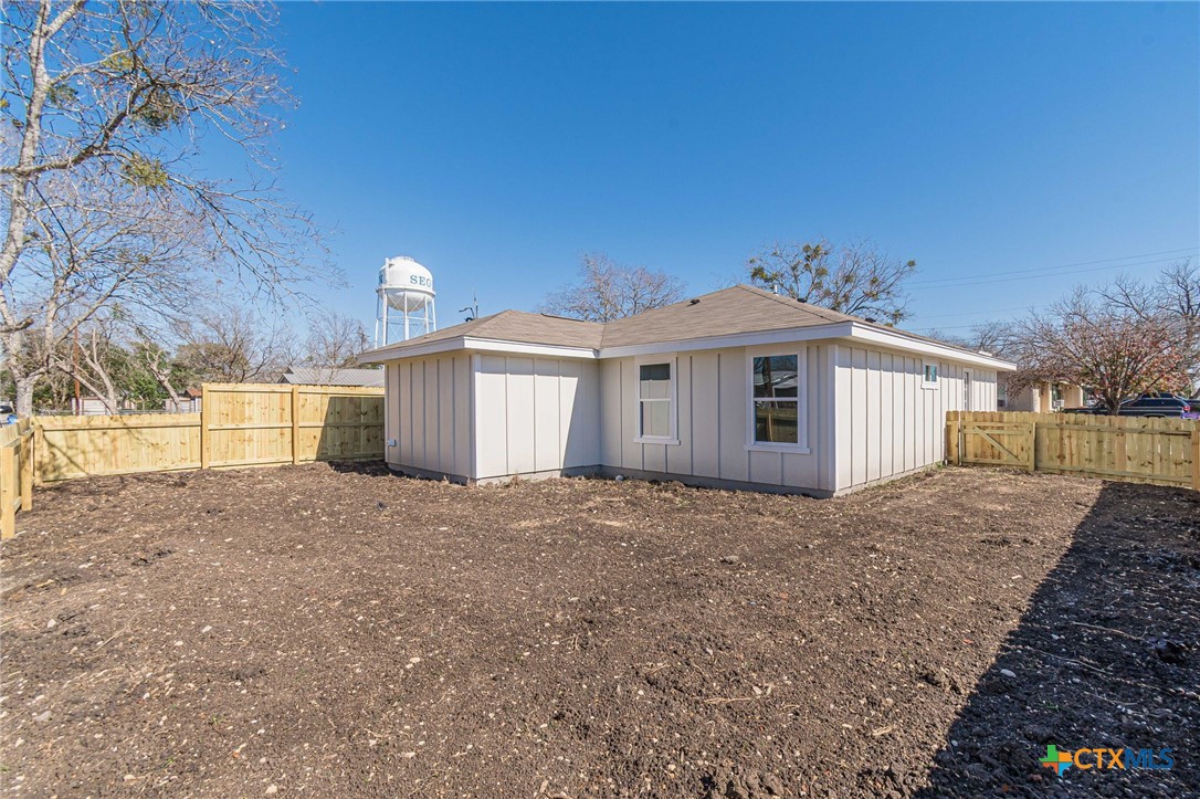 403 North Bauer Street Seguin, TX 78155 - Photo 21 of 27 a front view of a house with a yard and garage