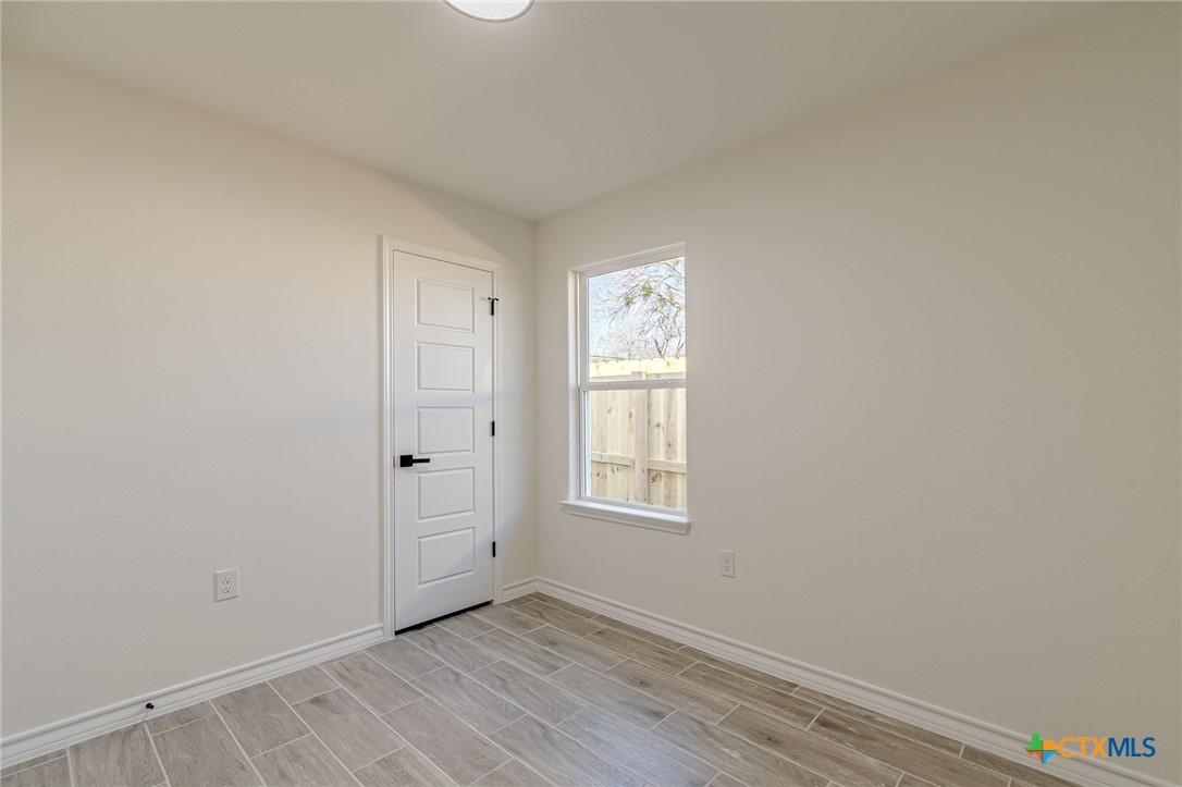 403 North Bauer Street Seguin, TX 78155 - Photo 6 of 27 an empty room with windows