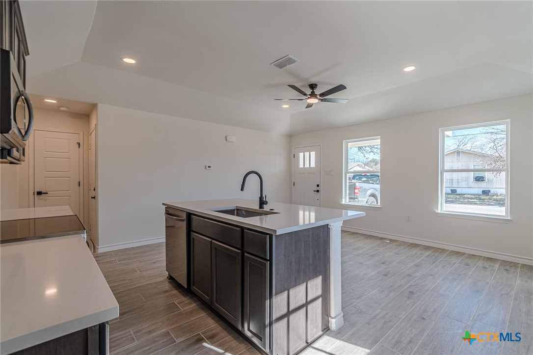 403 North Bauer Street Seguin, TX 78155 - Photo 9 of 27 a view of kitchen and sink with wooden floor