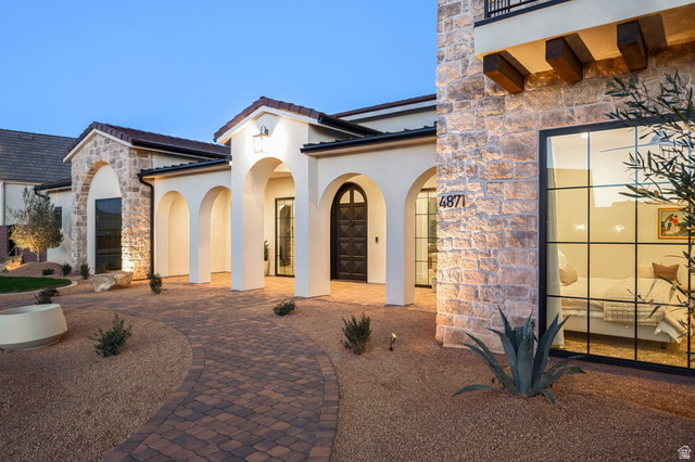 4871 South Homestead Way Washington, UT 84780 - Photo 8 of 151 Property entrance with stone siding, stucco siding, and a tiled roof