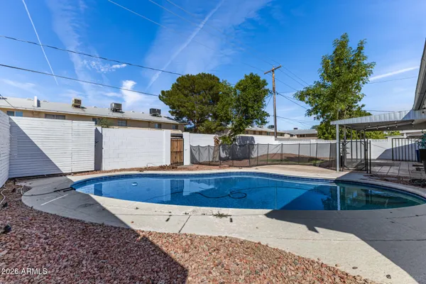 a view of swimming pool with outdoor seating