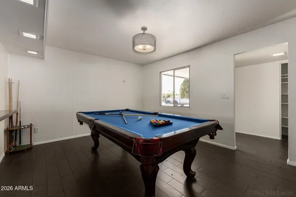 a dining room with a table and chairs